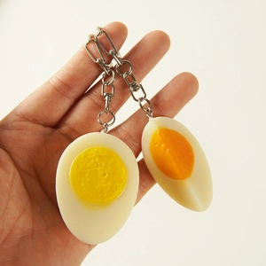 Realistic PVC boiled egg keychain model with lifelike yolk texture and silver metal ring