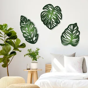 Modern set of three dark green metal Monstera leaf wall art for home decoration