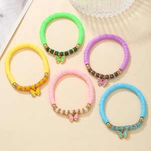 Colorful fruit clay bracelet set with butterfly charms and rhinestone spacers