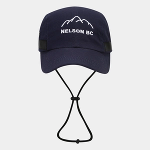 Detail of mountain embroidery and windproof rope on navy blue quick-dry baseball cap