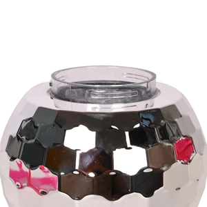 Macro shot of disco ball cup faceted surface with pink cowboy hat lid and straw detail