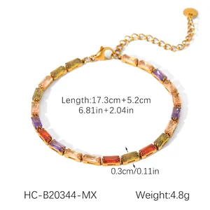 Macro detail of 18K gold plated bracelet with colorful zircon stones and lobster clasp