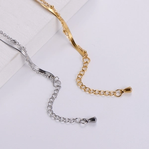 Minimalist gold and silver layered heart charm bracelet with snake and bead chain
