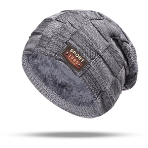 Grey knit winter hat with fleece lining and leather sport patch for cold protection