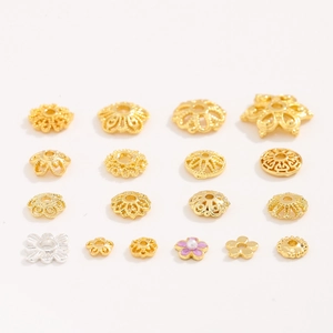 Detailed macro view of various 18K gold plated hollow flower bead caps for DIY jewelry
