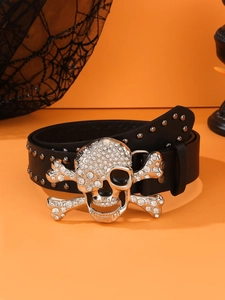 Close-up of black leather belt with silver skull buckle and sparkling rhinestones
