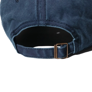 Detailed close-up of dark blue washed cotton baseball cap with adjustable metal buckle back