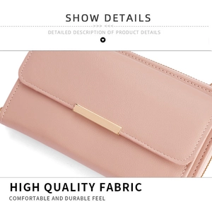Detail of high-quality dusty pink PU leather texture and gold metal bar on women's wallet