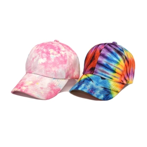 Trendy tie-dye baseball caps with colorful 3D prints and pink cloud pattern on white background