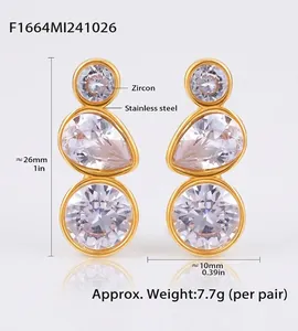 Detailed view of gold stainless steel earrings with stacked white zircon stone accents