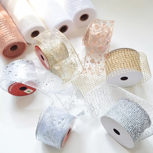Close-up of sparkling Christmas ribbons with snowflakes and sequins in various metallic colors