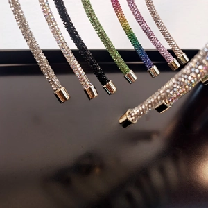 Detail view of colorful rhinestone headbands with luxury sparkling stones and gold tips