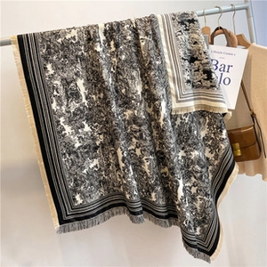 Detail shot of Toile de Jouy pattern scarf with fringe edges and soft textile texture