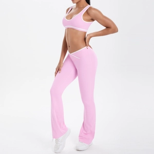 Detail of pink yoga set with white contrast trim and V-waist flared pants design