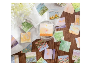 Autocollants artistiques aux tons roses avec paysages et fleurs sur table en bois