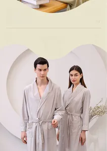 Detail of silver grey waffle textured bathrobe with tie closure and large front pockets