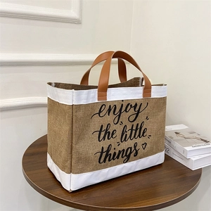 Linen tote bag with leather handles and enjoy the little things print in khaki and white