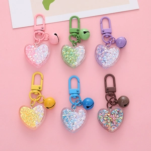 Llaveros de corazón acrílico de colores con estrellas origami y cascabeles set de 6