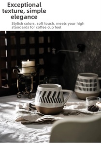 Detailed view of dual-tone ceramic coffee mug with geometric patterns and triangle handle