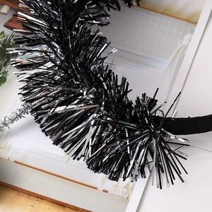 Festive Halloween garland with shiny black and silver metallic tinsel for party decoration