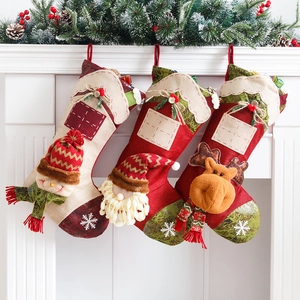 Three Christmas stockings with 3D Santa, Snowman and Reindeer hanging on a white fireplace