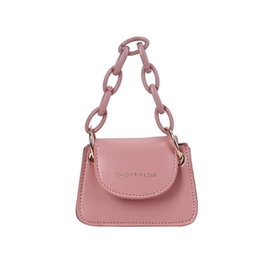 Pink mini jelly bag with thick chain handle and gold lettering on a white background