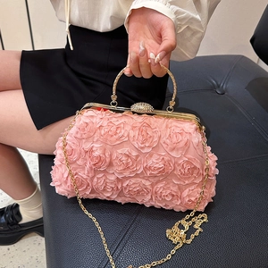 Elegant pink floral evening clutch with golden handle and chain strap for weddings