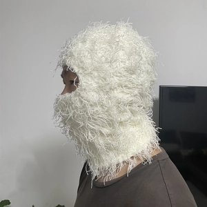 Detail of white plush balaclava with long faux fur texture and full face coverage