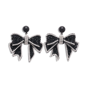 Sparkling black bow earrings with crystals and silver rhinestones on white background
