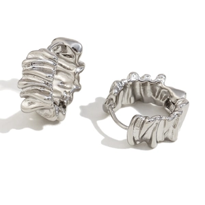 Irregular textured silver lava earrings in stainless steel with a minimalist geometric design