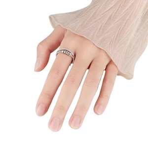 Adjustable silver spinner ring with five rotating zircon beads for anxiety relief on hand