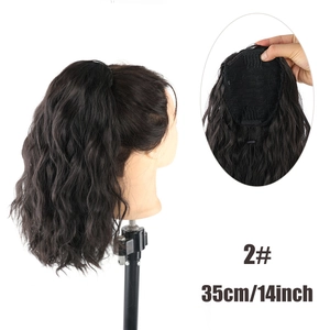 Detail of 35cm wavy drawstring ponytail hairpiece with inner mesh and clip design