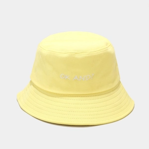 Detail of OK AND? white embroidery on light yellow cotton twill fisherman hat