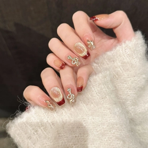 Red French gold foil cat eye press-on nails with luxury glitter and rhinestone charms