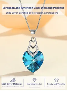Detailed macro view of S925 silver heart necklace with blue crystal and diamond accents