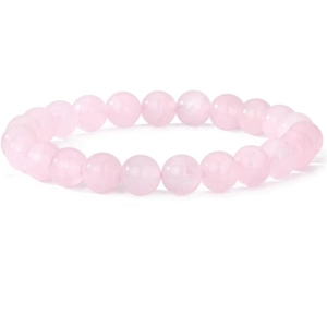 Natural pink crystal bead bracelet made of round rose quartz stones on white background