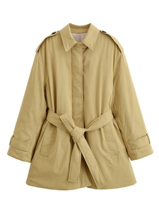 Close-up of khaki mid-length trench coat detailing belted waist and classic epaulettes