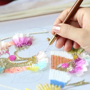 Detail of adjustable French embroidery tambour needle with wooden handle for beadwork