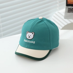 Detail of bear embroidery and contrast stitching on a toddler cotton baseball cap