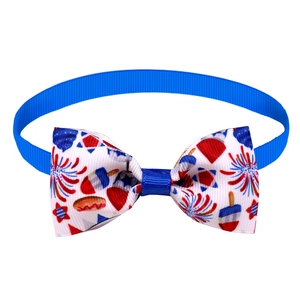 Detail of adjustable blue pet bowtie with festive Independence Day firework patterns