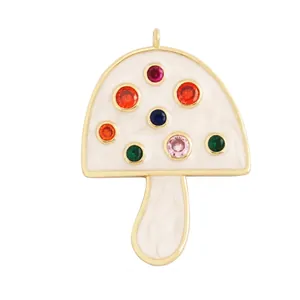 Detail view of large white enamel mushroom pendant with colorful gemstones and dimensions