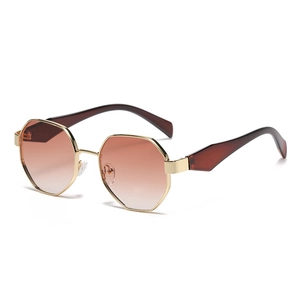 Modern octagonal metal sunglasses with gradient brown lenses and golden frame for women