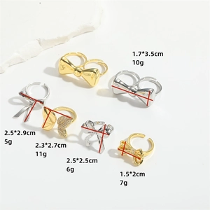 Luxurious open bow rings in gold and silver finish with sparkling zircons set