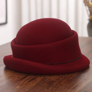 Detail view of burgundy wool felt cloche hat with black bead trim and rolled brim edge