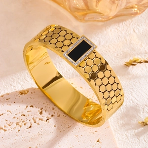 Gold honeycomb cuff bracelet with black gemstone and crystal pavé setting in vintage style