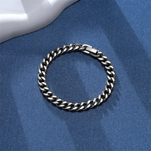Close-up of vintage punk silver Cuban link bracelet with secure fold-over clasp detail