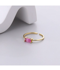 Close-up of a 925 silver vintage ring with a pink rectangular gemstone and golden band