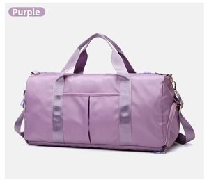 Detail of purple sports bag featuring reinforced handles and durable nylon fabric