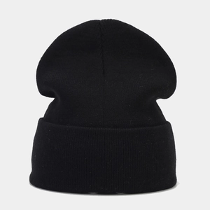 Close-up of black ribbed knit beanie with high-quality warm texture for winter