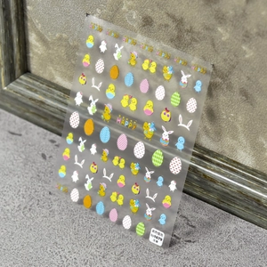 Easter themed 3D embossed nail stickers featuring cute eggs and rabbits for DIY manicures